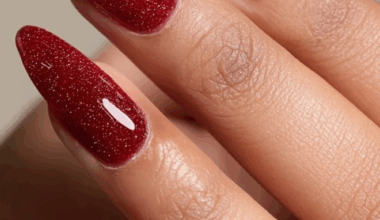 Festive Garnet Glitter Almond Nails