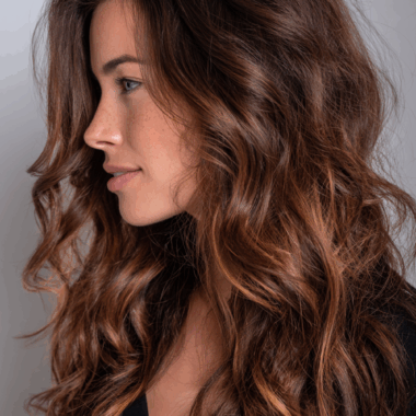Dark hair with balayage highlights featuring caramel and honey tones for natural dimensional color
